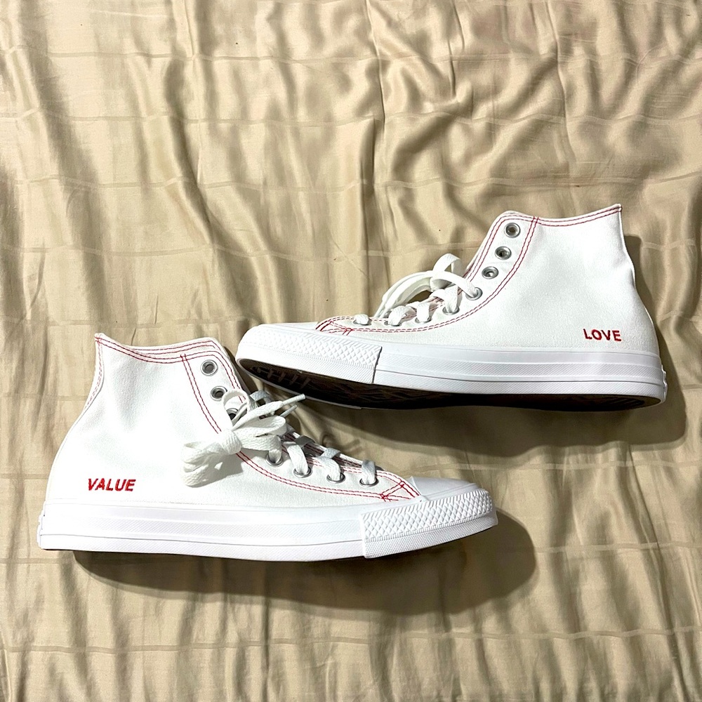 Converse White High-Top Sneakers with Red Stitching and Text